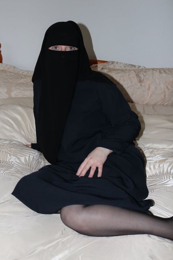 Burqa in stockings and suspenders