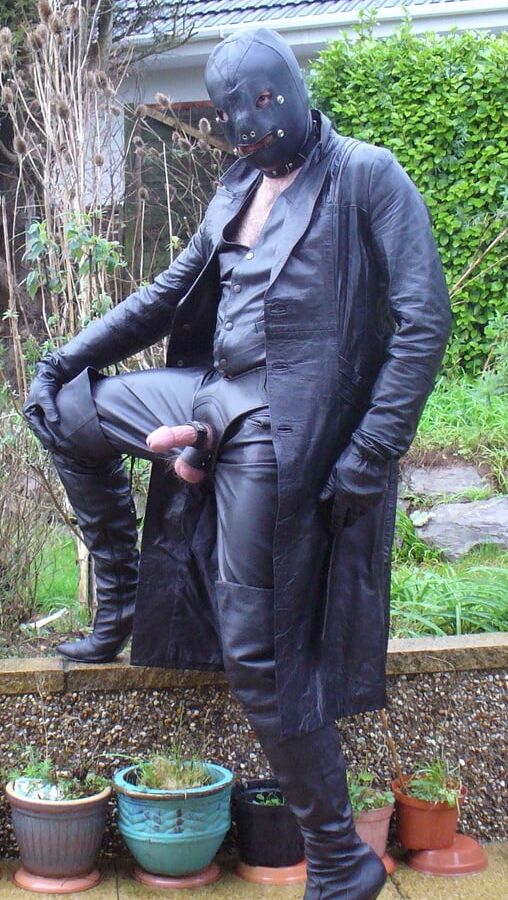Leather Master in cock harness, boots and hood