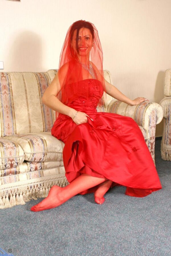 Red satin gown and white full-back nylonpanties