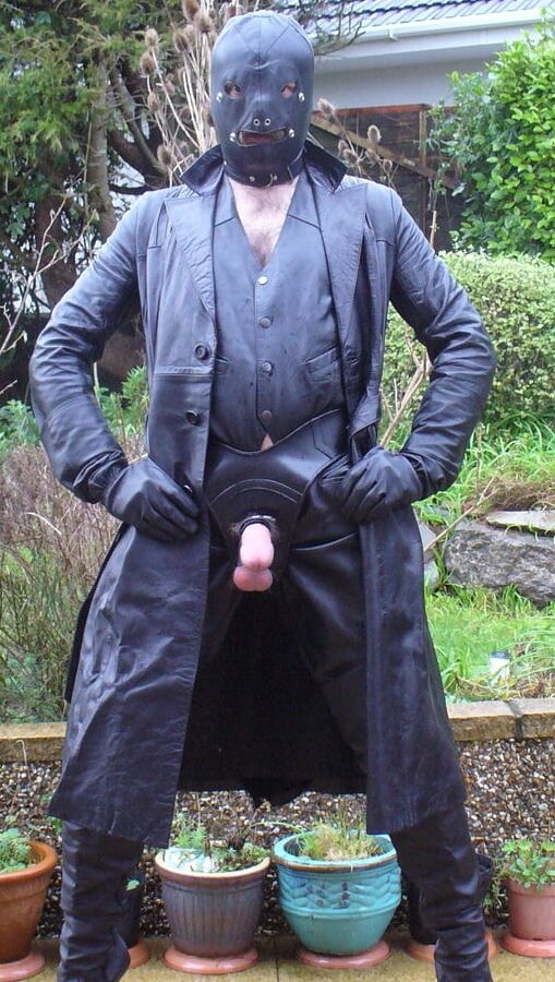 Leather Master in cock harness, boots and hood