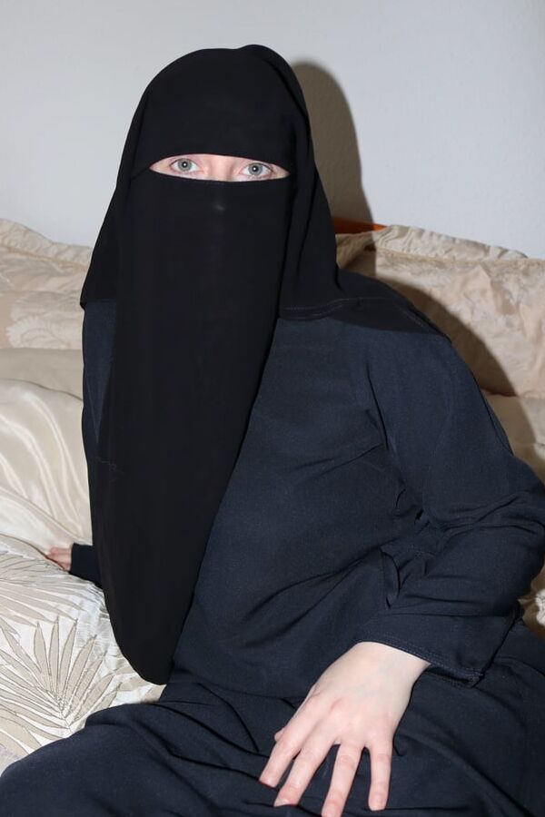 Burqa in stockings and suspenders