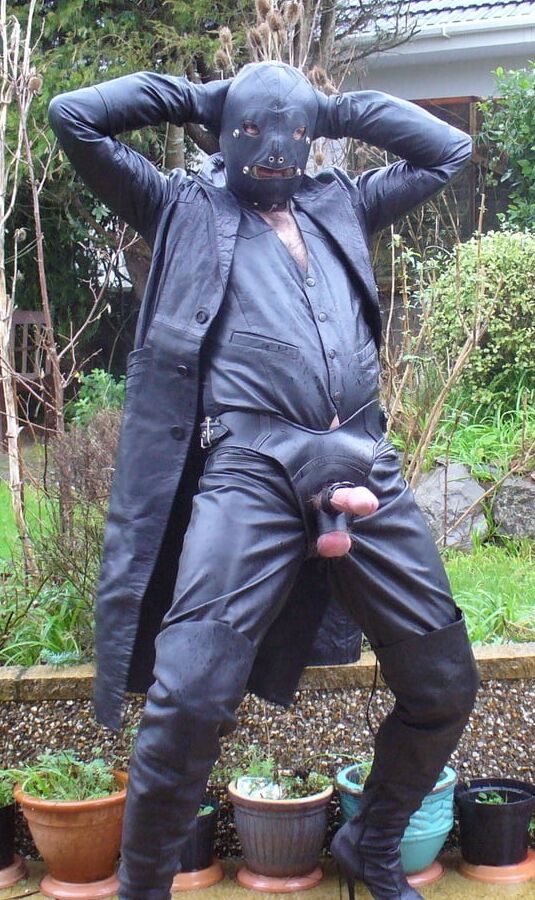 Leather Master in cock harness, boots and hood
