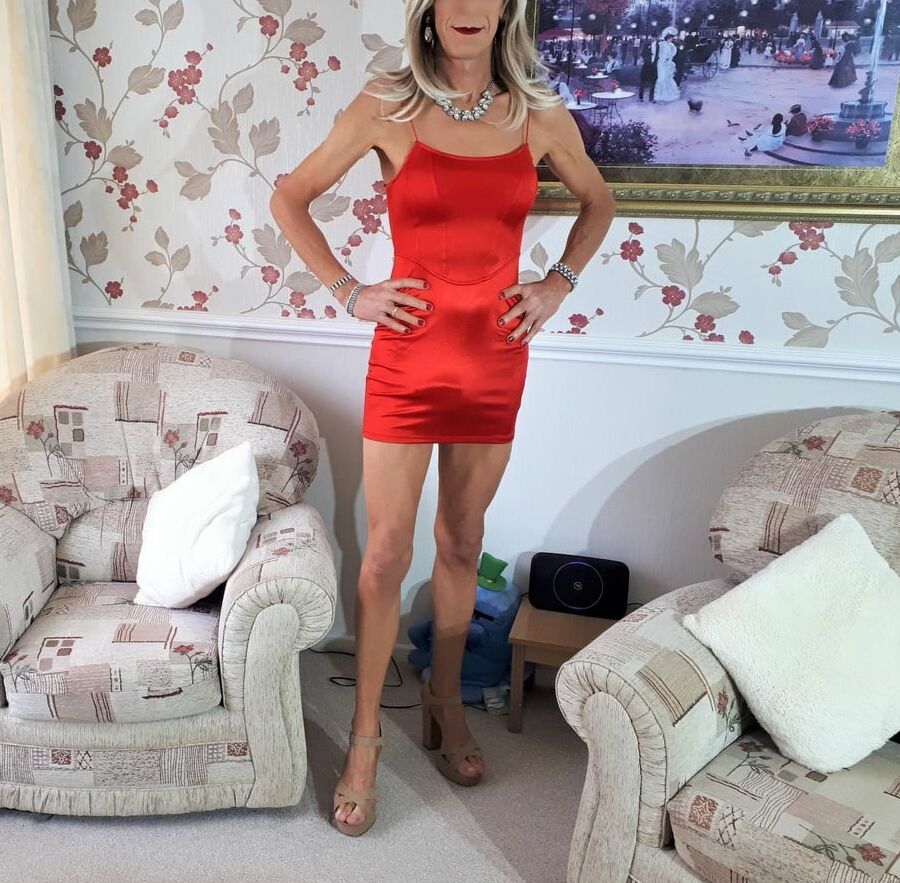 Alessia Travestita models red silk bodycon minidress
