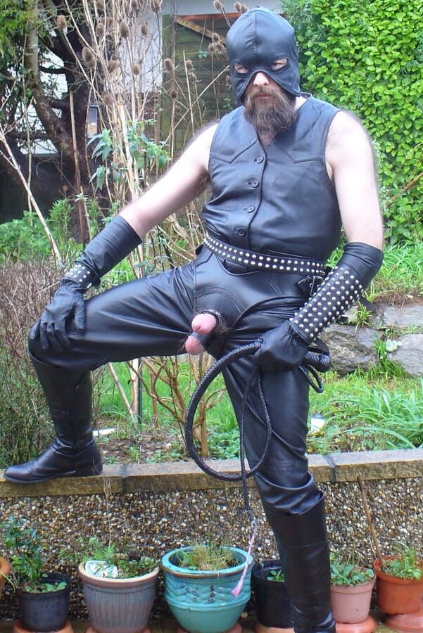Leather Master in cock harness, boots and hood