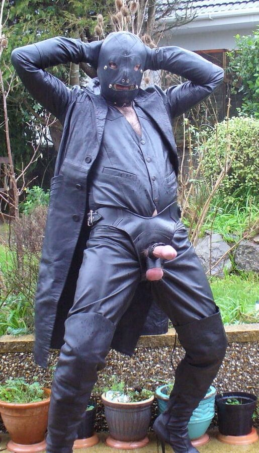 Leather Master in cock harness, boots and hood
