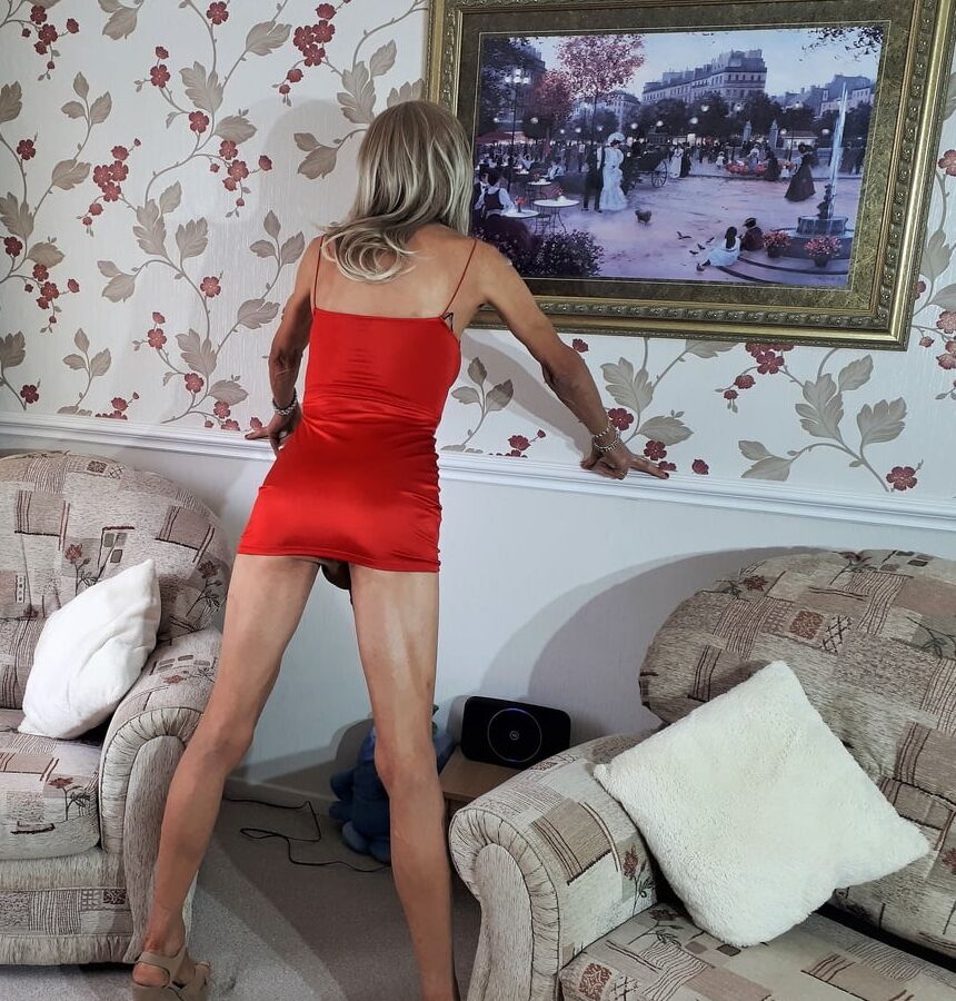 Alessia Travestita models red silk bodycon minidress
