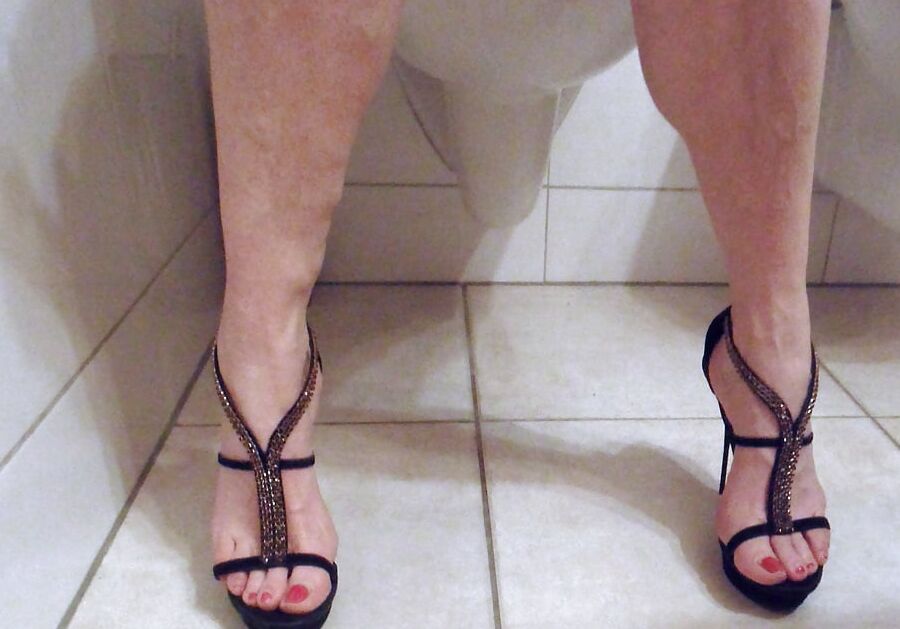 sucking my wifes sandal after having jerked onto her feet