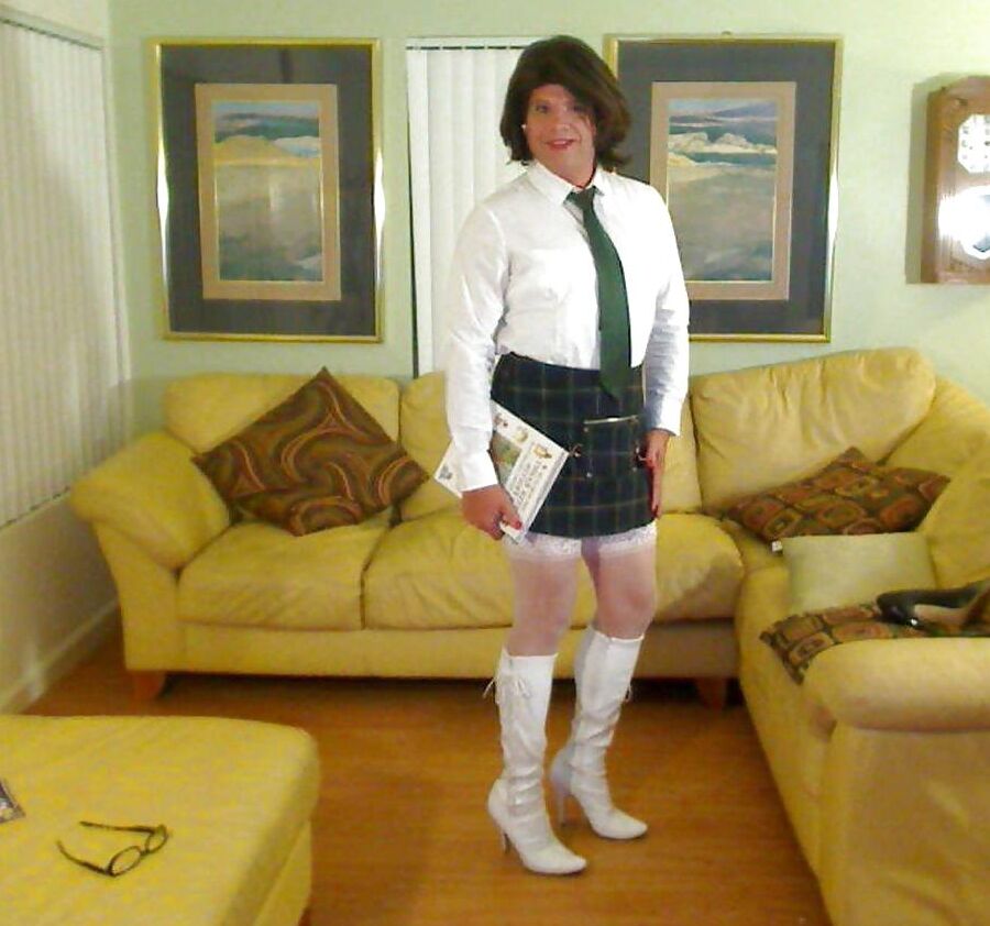 Miss Christi in various corsettes and school girl uniform