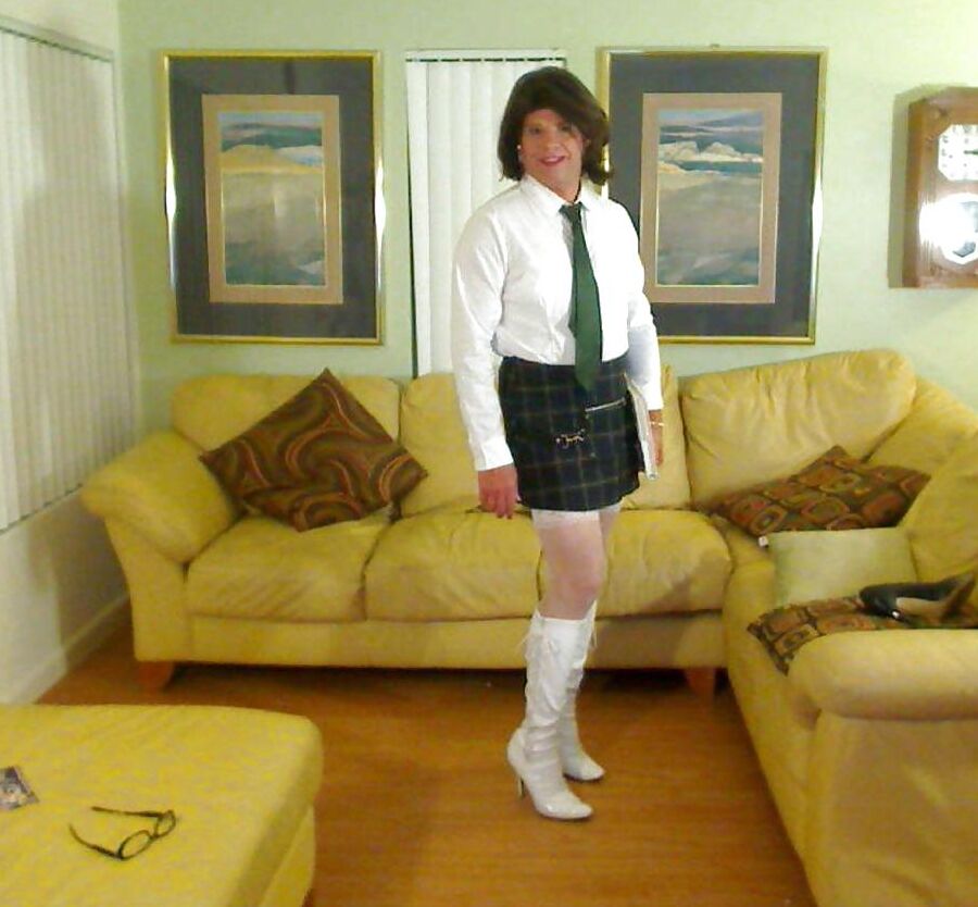 Miss Christi in various corsettes and school girl uniform