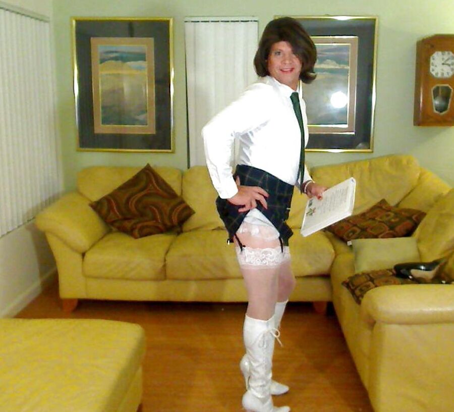 Miss Christi in various corsettes and school girl uniform