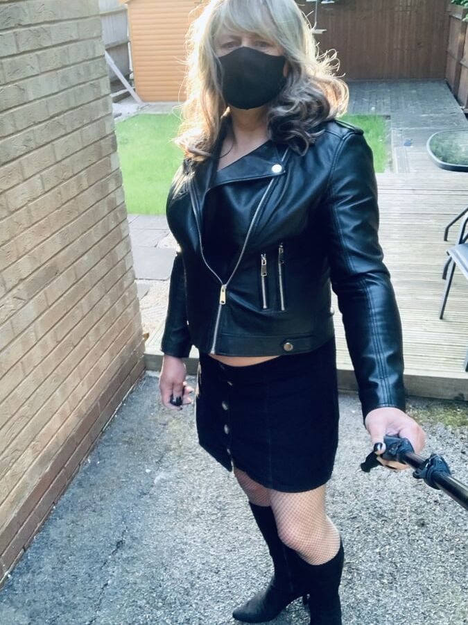 Kelly in fishnets and black boots