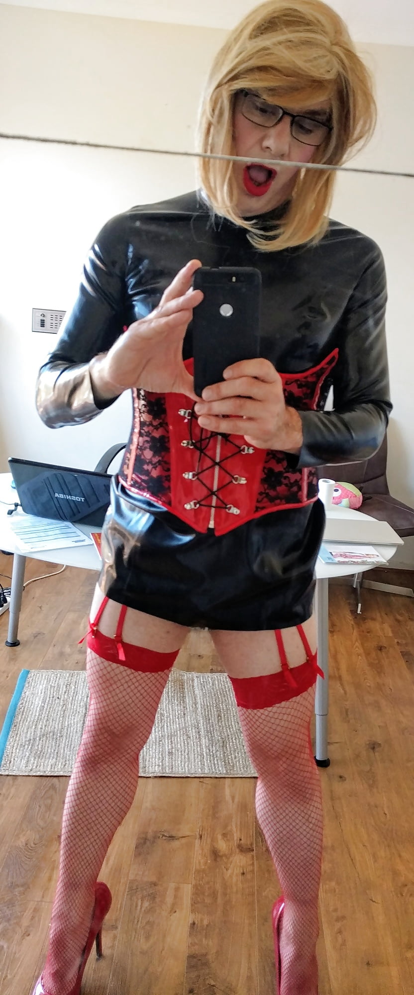 Red fishnets and hot corset combo