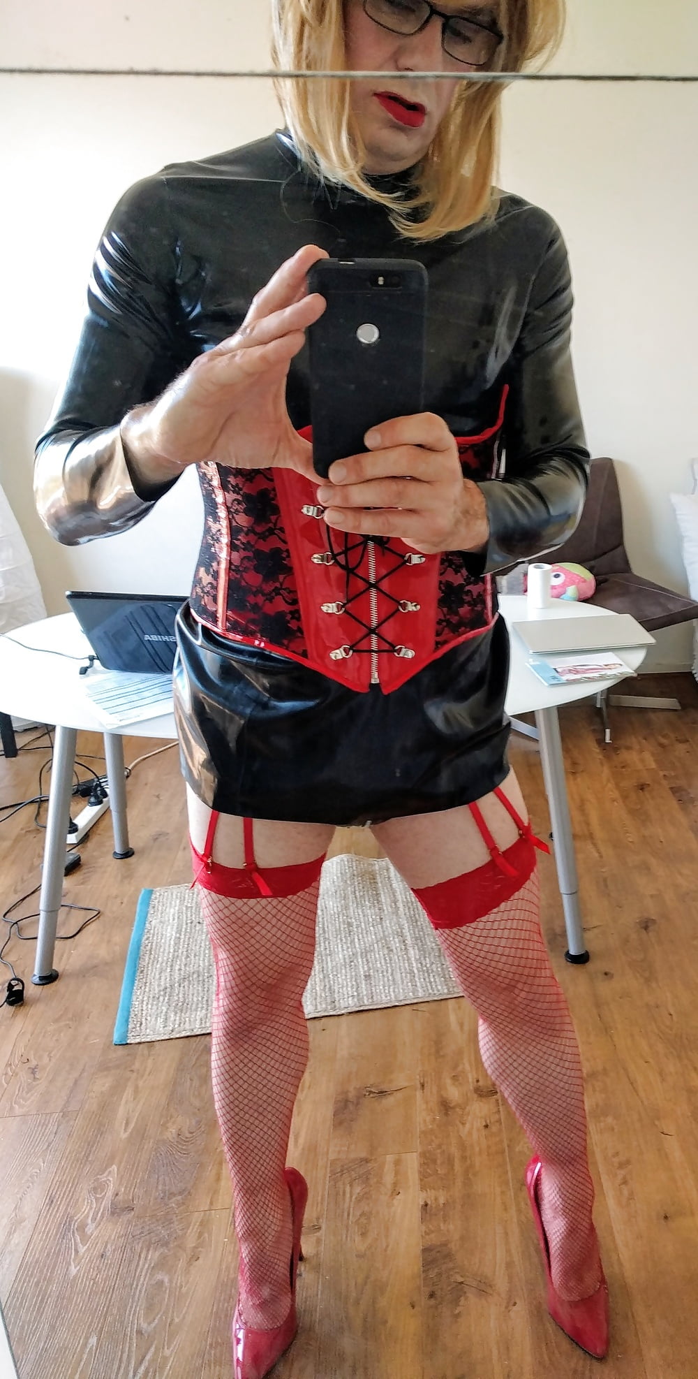 Red fishnets and hot corset combo