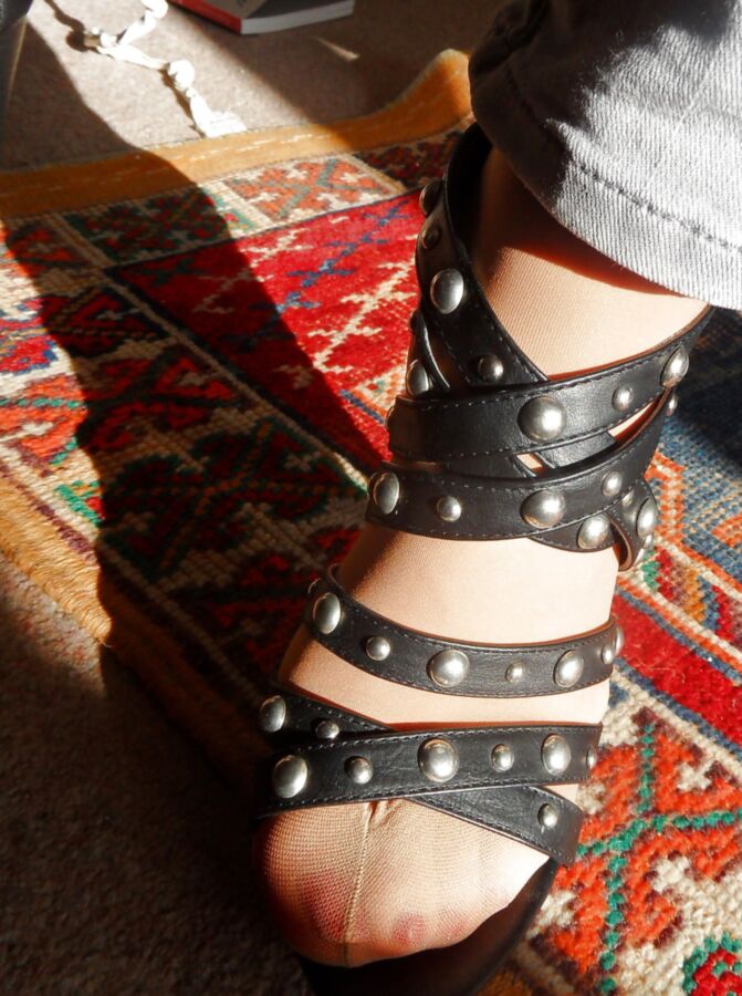 studded high heels of my wife with painted toenails
