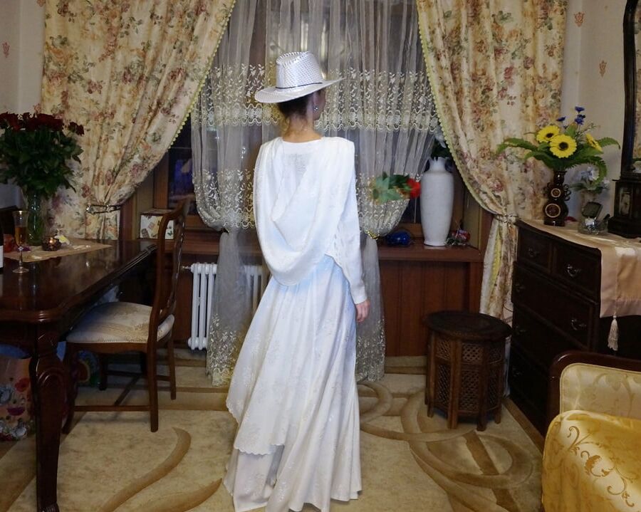 In Wedding Dress and White Hat