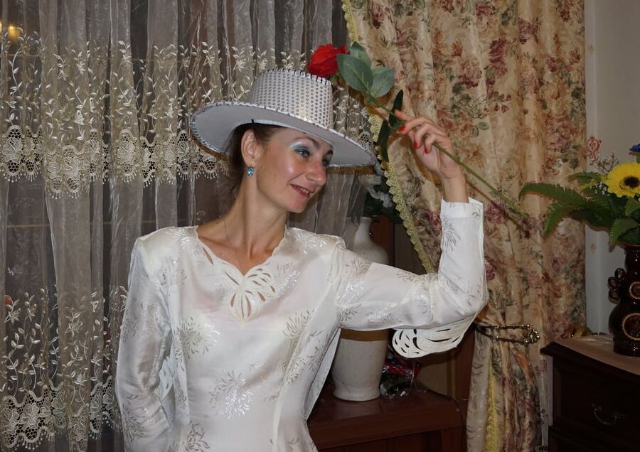 In Wedding Dress and White Hat