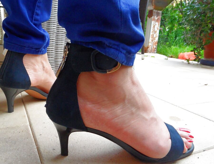 studded high heels of my wife with painted toenails