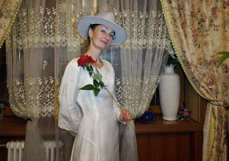 In Wedding Dress and White Hat