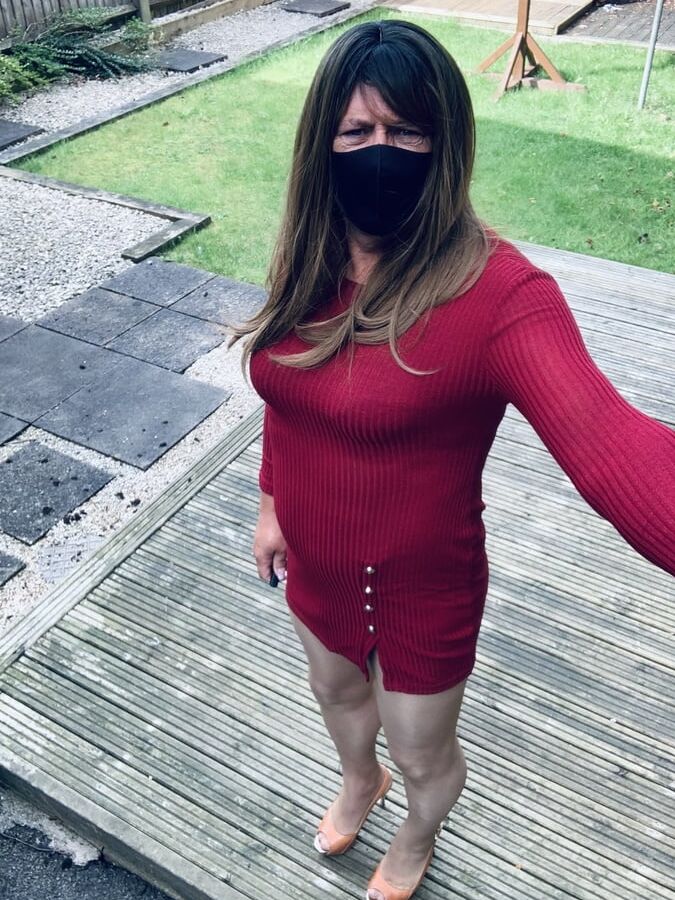 Kelly in burgundy dress and nude tights with heels