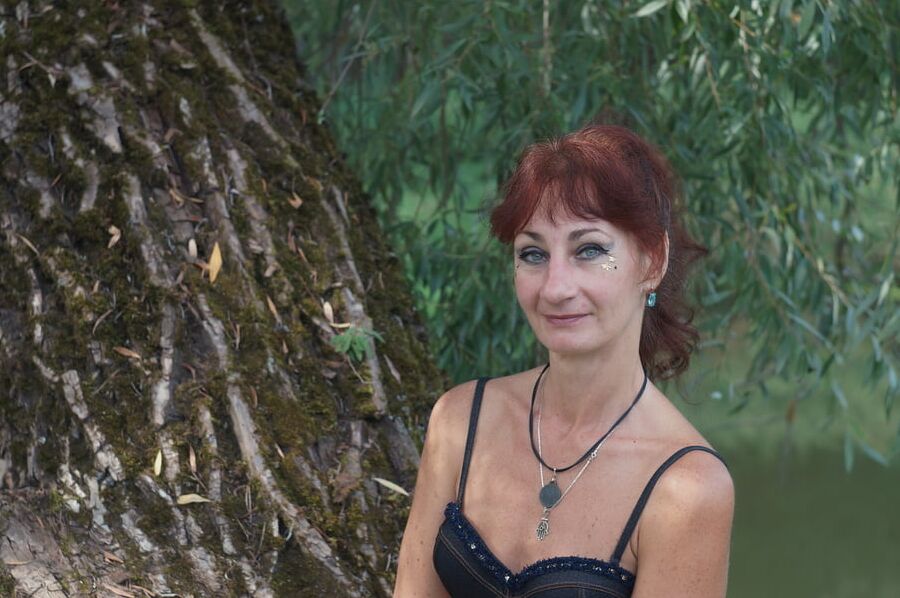 Black bikini near tree upon river