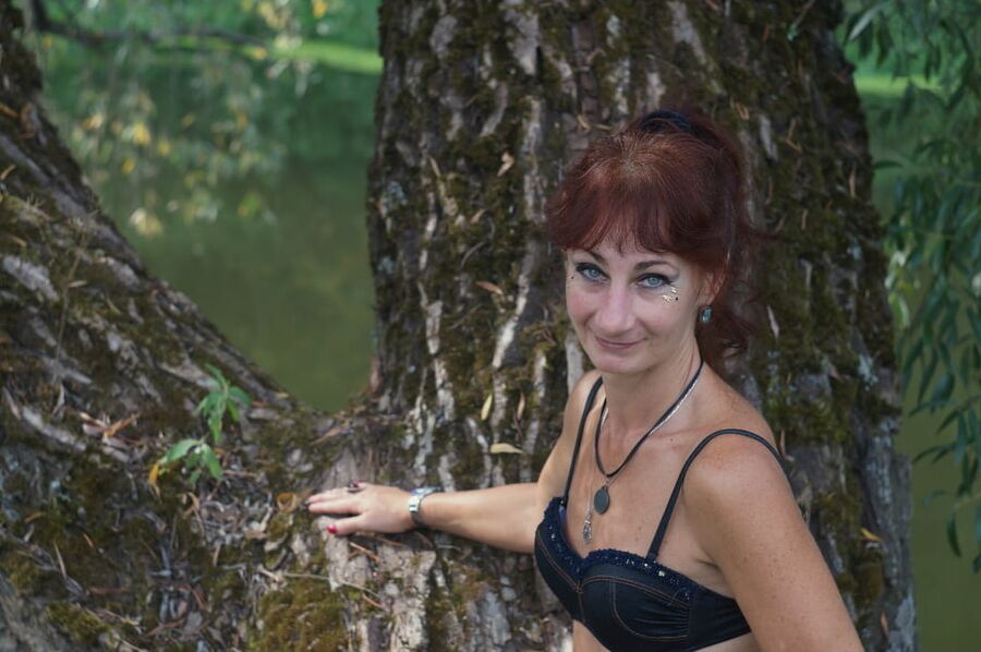 Black bikini near tree upon river