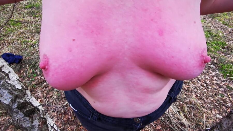 Titslapping in woods