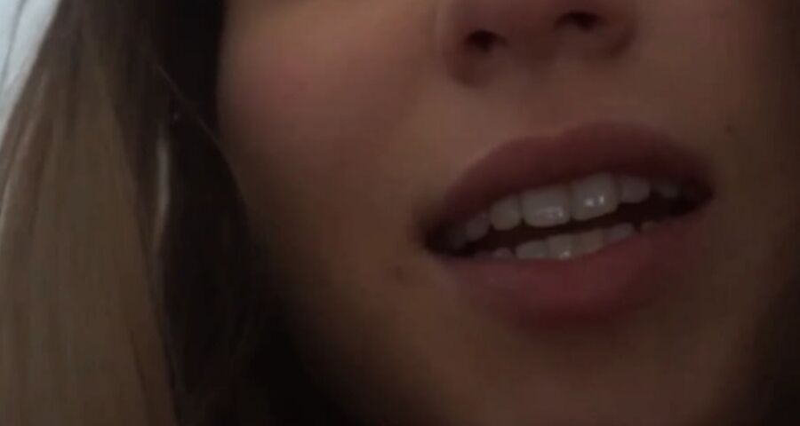 Hottie flirting on webcam close up.