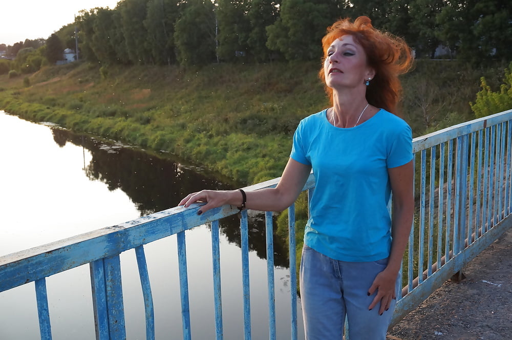 Flamehair in evening on the bridge