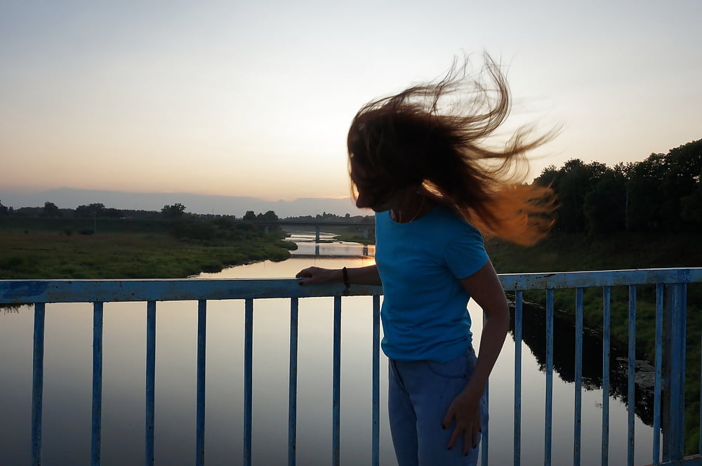 Flamehair in evening on the bridge