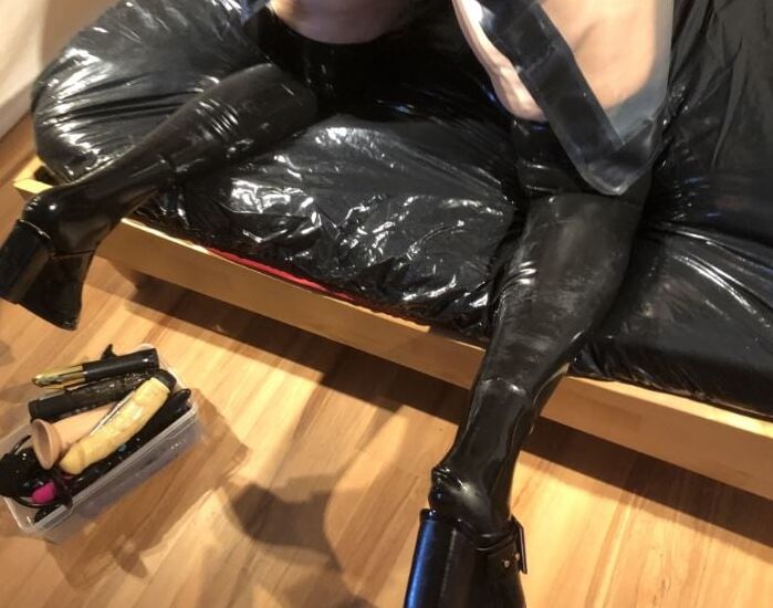 Latex and Dildos on Bed