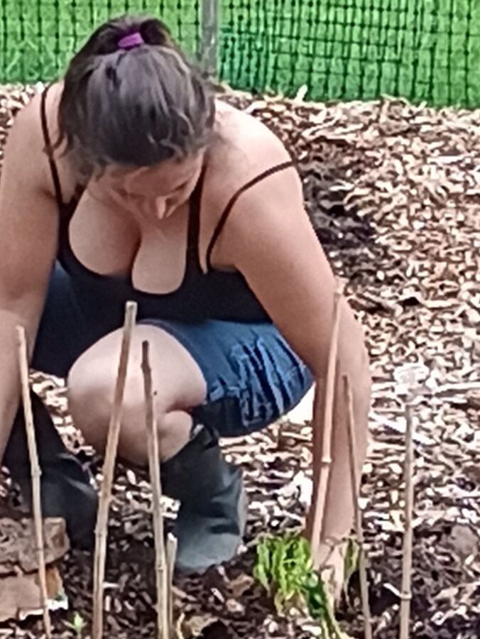 Big hanging tits while gardening