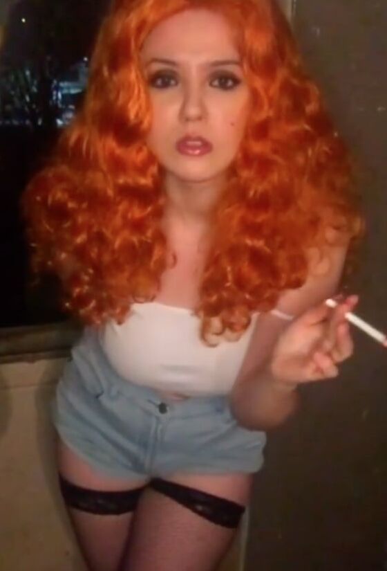 Smoking redhead beauty