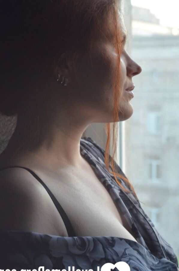 Posing by the window in a hot outfit