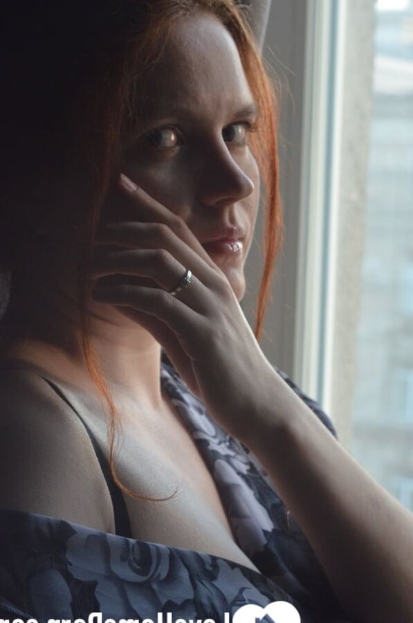 Posing by the window in a hot outfit