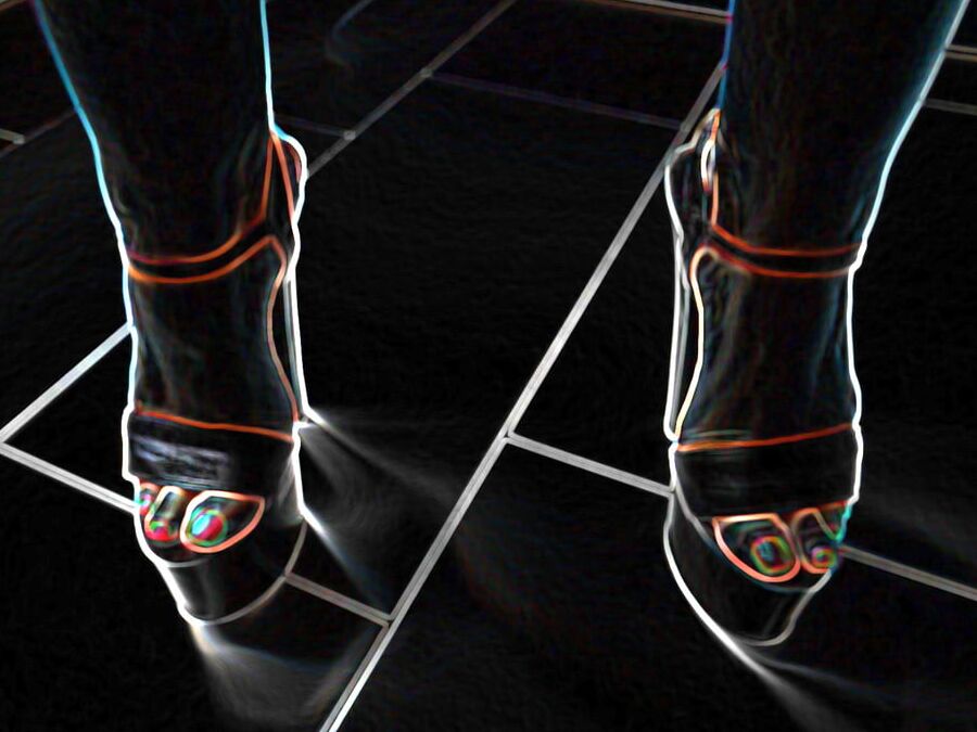 Luminous contours of legs, heels and ass