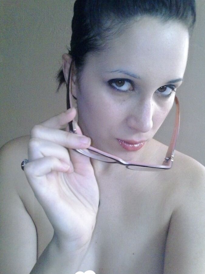 Nerdy girl sensually fingers her wet snatch