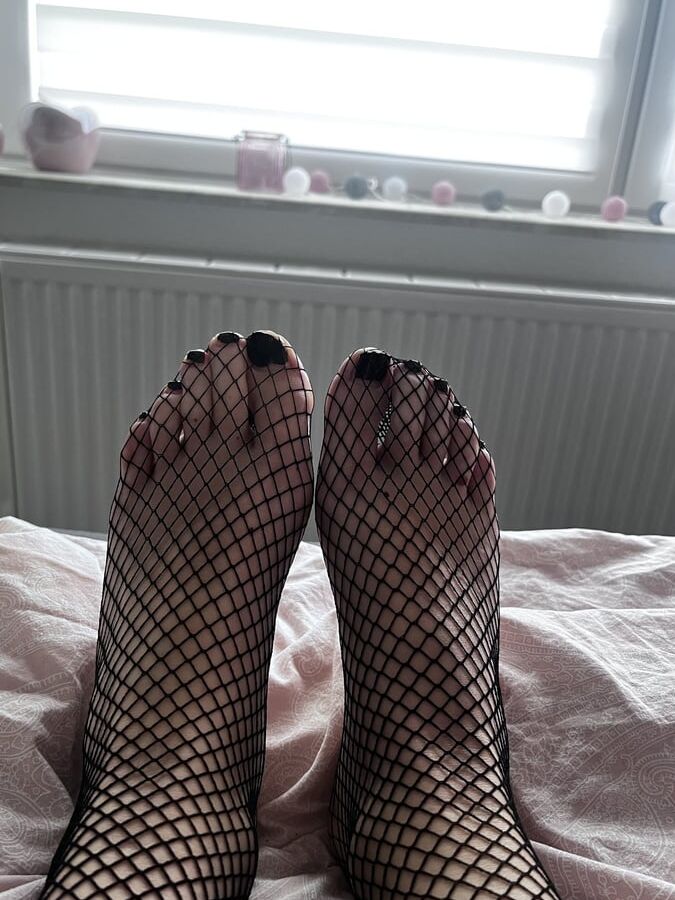 Foot with fishnet socks