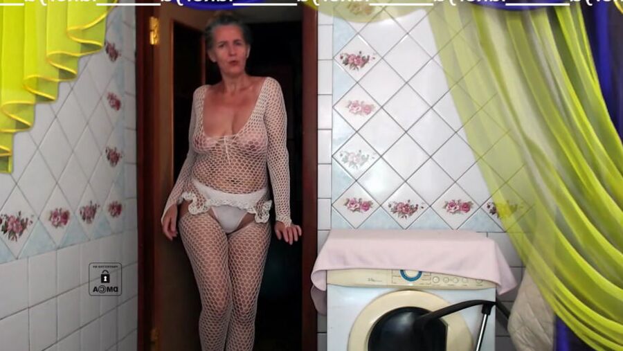 Old body of sexy Lukerya in white fishnet with visible nippl
