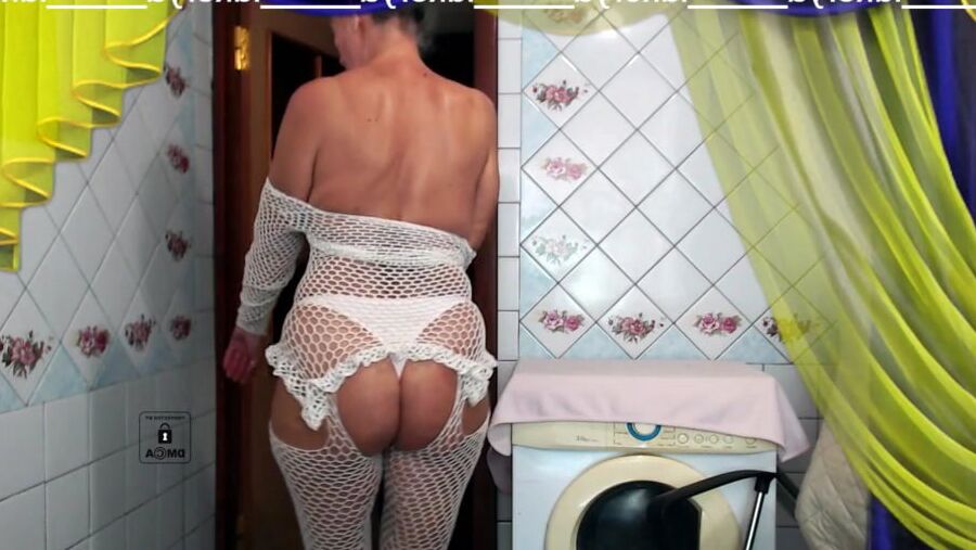 Old body of sexy Lukerya in white fishnet with visible nippl