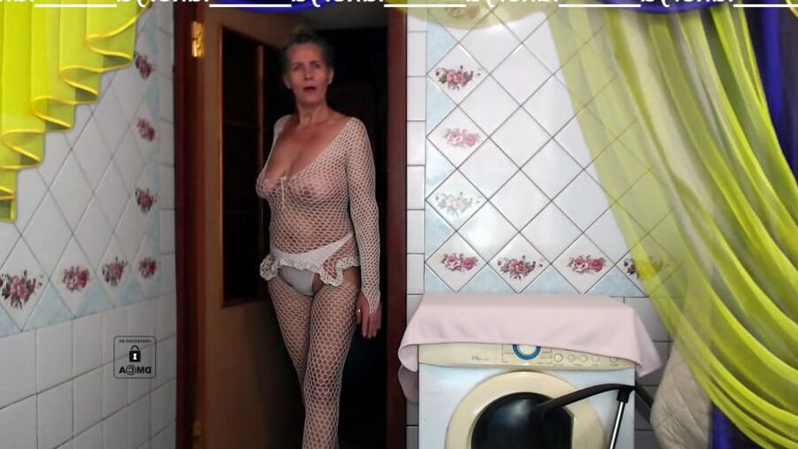 Old body of sexy Lukerya in white fishnet with visible nippl