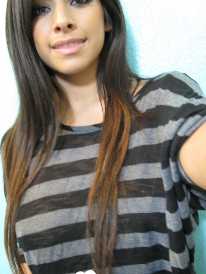 Brunette teases a bit in the bathroom