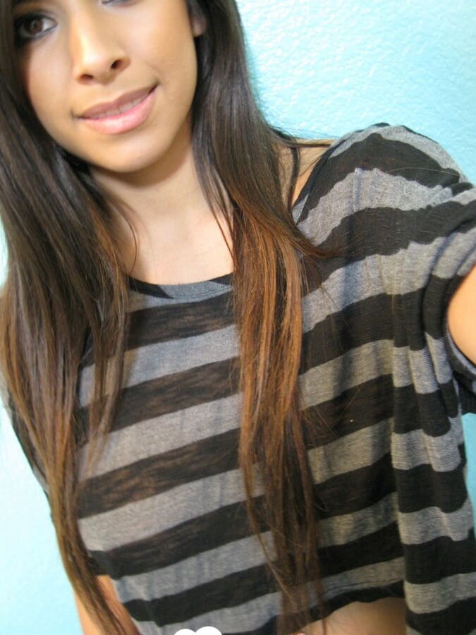 Brunette teases a bit in the bathroom