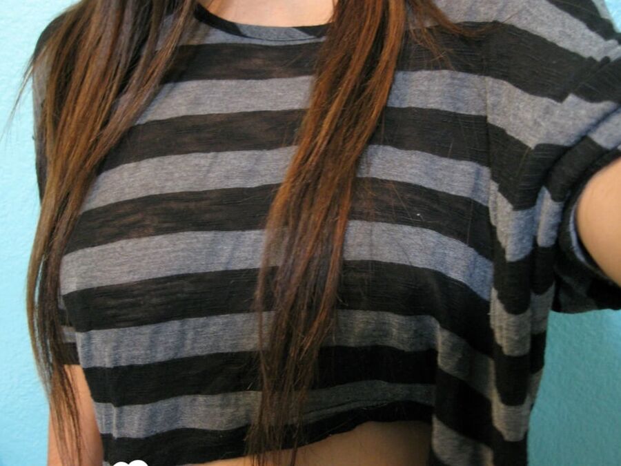 Brunette teases a bit in the bathroom