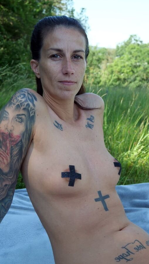 Nudist MILF sunbathing and masturbating