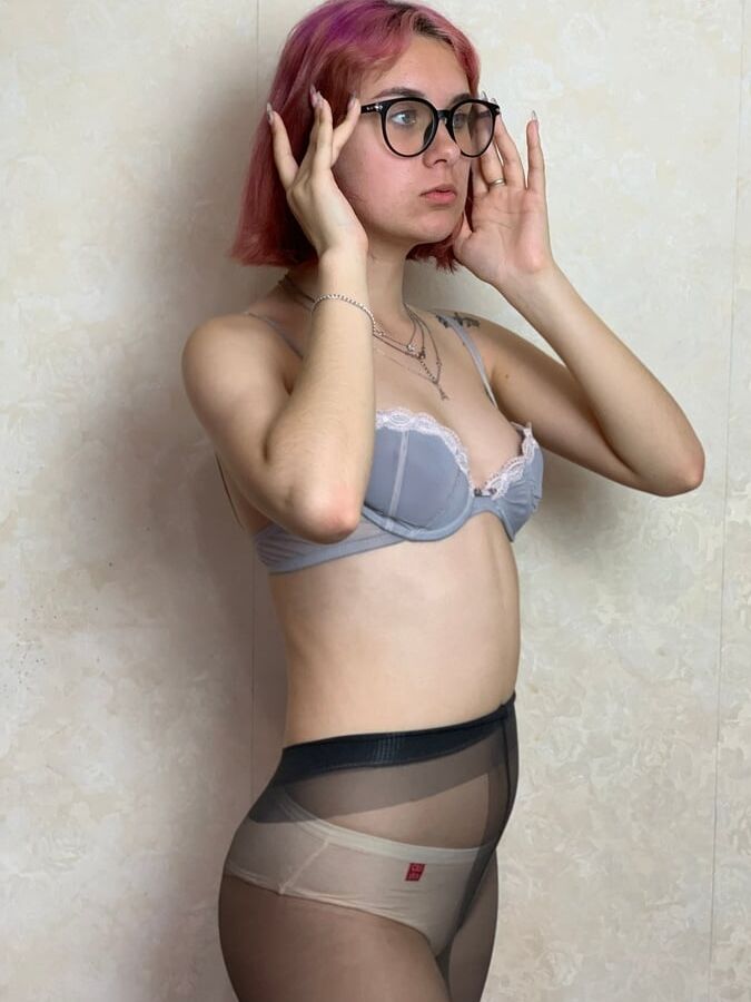 Nerdy Babe In Bra, Panties and Pantyhose
