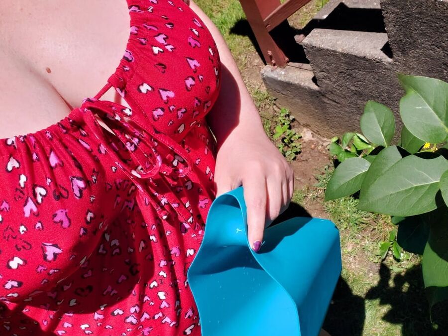 Daddy's babygirl showing off huge tits outside in the garden