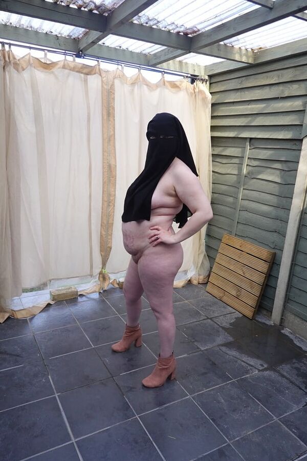 Nude in Niqab in ankle boots
