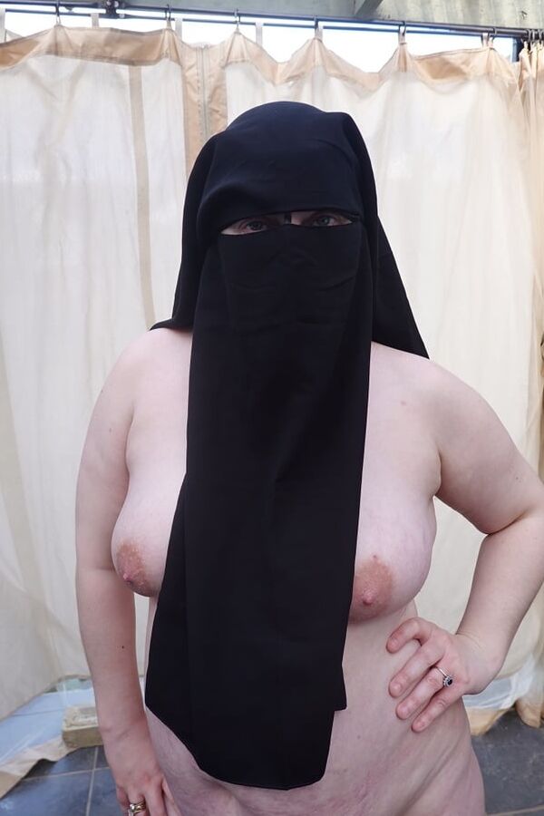 Nude in Niqab in ankle boots
