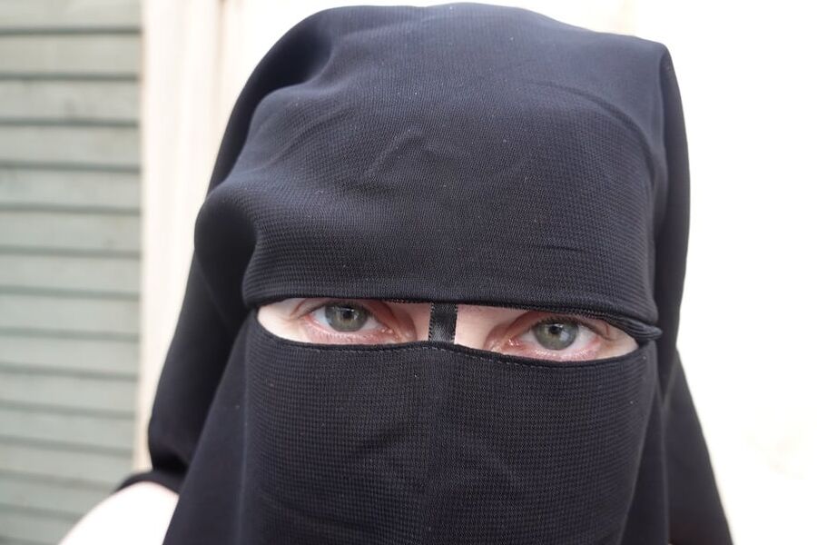 Nude in Niqab in ankle boots
