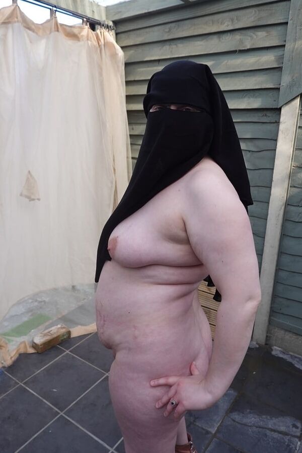 Nude in Niqab in ankle boots